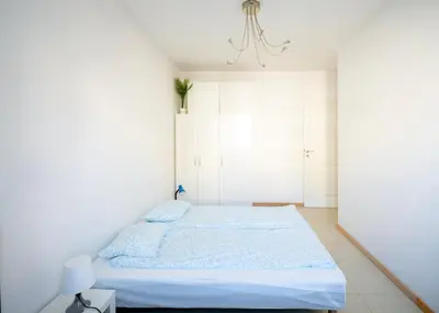 Łóżko lub łóżka w pokoju w obiekcie Fresh Green Kabaty apartment 4