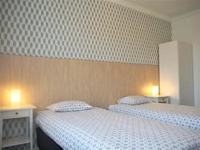 Łóżko lub łóżka w pokoju w obiekcie Apartamenty Dobranoc - Wawer 2