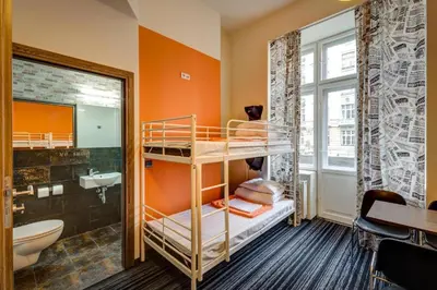Łóżko lub łóżka w pokoju w obiekcie Planet Hostel