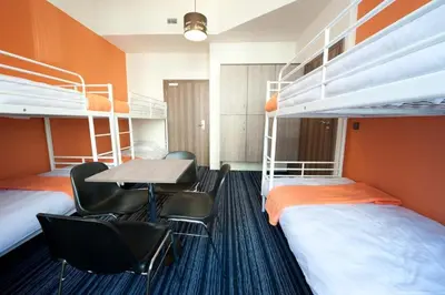 Łóżko lub łóżka w pokoju w obiekcie Planet Hostel