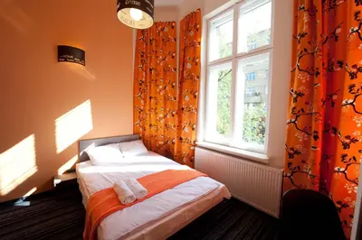 Łóżko lub łóżka w pokoju w obiekcie Planet Hostel