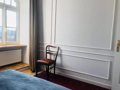 Łóżko lub łóżka w pokoju w obiekcie St. Florian Apartament