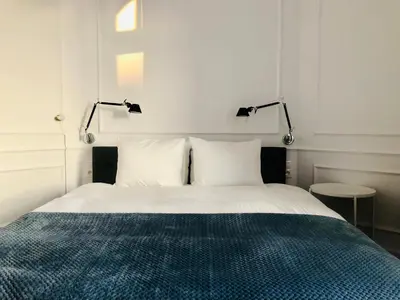 Łóżko lub łóżka w pokoju w obiekcie St. Florian Apartament