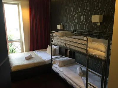 Łóżko lub łóżka w pokoju w obiekcie Apart Rooms Marszalkowska by WarsawResidence Group