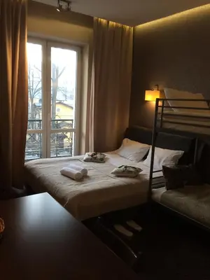 Łóżko lub łóżka w pokoju w obiekcie Apart Rooms Marszalkowska by WarsawResidence Group