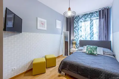 Łóżko lub łóżka w pokoju w obiekcie ClickTheFlat Sienna Center Apart Rooms
