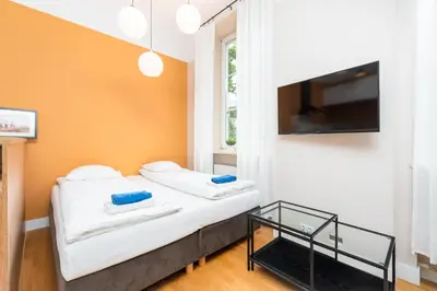 Łóżko lub łóżka w pokoju w obiekcie Apartment PREMIUM Nowy Świat by Your Freedom
