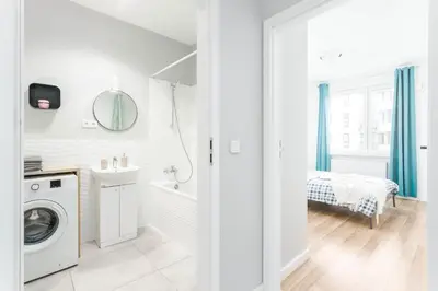 Łóżko lub łóżka w pokoju w obiekcie Chill Apartments Airport Ursynów