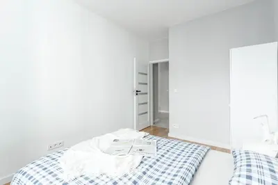 Łóżko lub łóżka w pokoju w obiekcie Chill Apartments Airport Ursynów