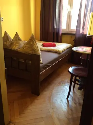 Łóżko lub łóżka w pokoju w obiekcie mika rooms - 22 Korotynskiego Street
