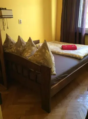 Łóżko lub łóżka w pokoju w obiekcie mika rooms - 22 Korotynskiego Street