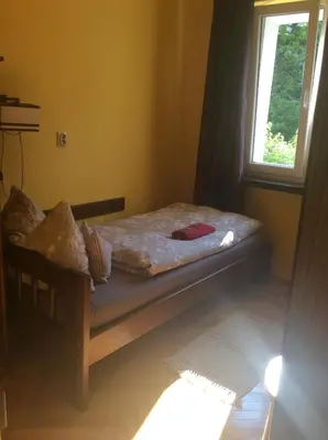 Łóżko lub łóżka w pokoju w obiekcie mika rooms - 22 Korotynskiego Street