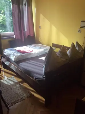 Łóżko lub łóżka w pokoju w obiekcie mika rooms - 22 Korotynskiego Street