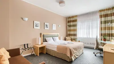 Łóżko lub łóżka w pokoju w obiekcie 404 Rooms Wilanowska