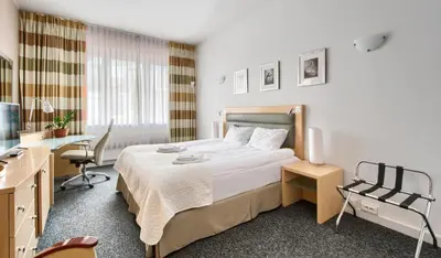 Łóżko lub łóżka w pokoju w obiekcie 404 Rooms Wilanowska