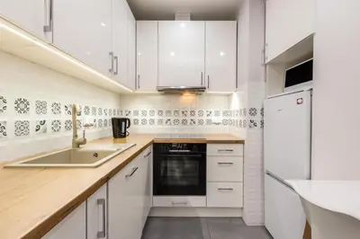 Kuchnia lub aneks kuchenny w obiekcie Galeria Rondo Wiatraczna Apartments