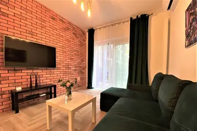Telewizja i/lub zestaw kina domowego w obiekcie erApartments Mennica Residence