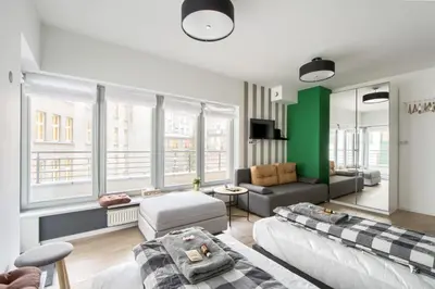 Łóżko lub łóżka w pokoju w obiekcie Labo Apartment Dzialdowska