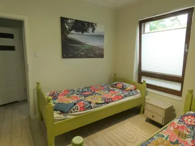 Łóżko lub łóżka w pokoju w obiekcie Folk apartment