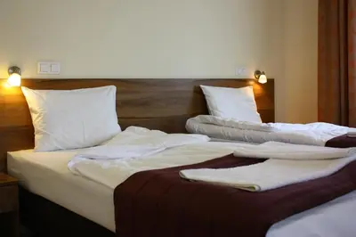 Łóżko lub łóżka w pokoju w obiekcie Hotel Czerniewski
