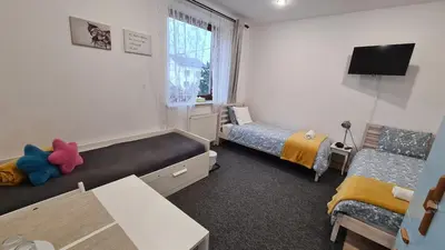 Łóżko lub łóżka w pokoju w obiekcie ALDAMI
