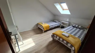 Łóżko lub łóżka w pokoju w obiekcie ALDAMI