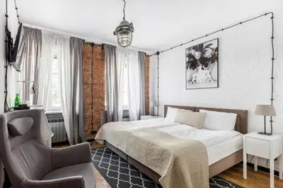 Łóżko lub łóżka w pokoju w obiekcie ARTHOTEL STALOWA 52