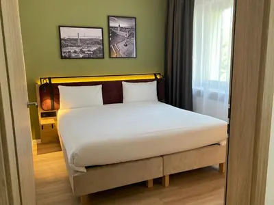 Łóżko lub łóżka w pokoju w obiekcie Campanile Warszawa Północ