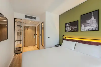 Łóżko lub łóżka w pokoju w obiekcie Campanile Warszawa Północ