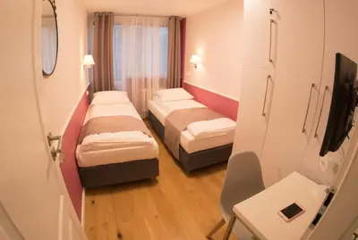 Łóżko lub łóżka w pokoju w obiekcie Apartament Hotel Grzybowska 9