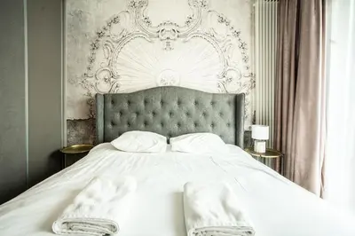 Łóżko lub łóżka w pokoju w obiekcie VipWarsawApartments Sapphire Mennica Residence