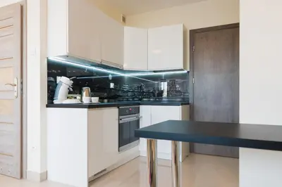Kuchnia lub aneks kuchenny w obiekcie Aparthotel Koroni Home