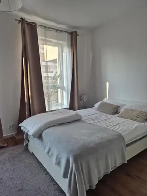 Łóżko lub łóżka w pokoju w obiekcie Great Apart Mokotów