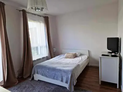 Łóżko lub łóżka w pokoju w obiekcie Great Apart Mokotów
