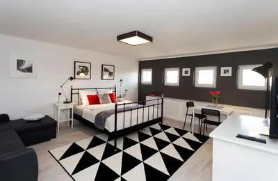 Łóżko lub łóżka w pokoju w obiekcie Warsawrent Apartamenty Centralna