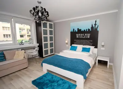 Łóżko lub łóżka w pokoju w obiekcie Warsawrent Apartamenty Centralna