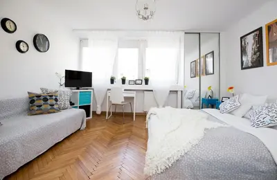 Łóżko lub łóżka w pokoju w obiekcie Warsawrent Apartamenty Centralna