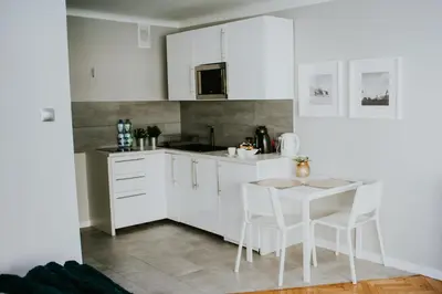 Kuchnia lub aneks kuchenny w obiekcie Warsawrent Apartamenty Centralna