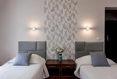 Łóżko lub łóżka w pokoju w obiekcie Hotel 