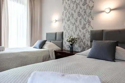 Łóżko lub łóżka w pokoju w obiekcie Hotel 