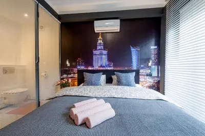 Łóżko lub łóżka w pokoju w obiekcie My Beloved Warsaw