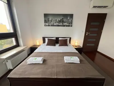 Łóżko lub łóżka w pokoju w obiekcie Apartament H&P Silver