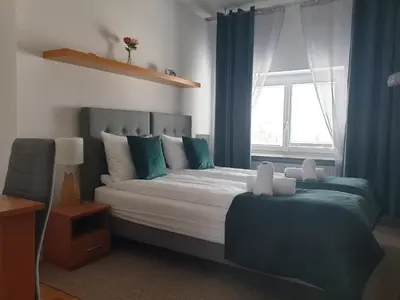 Łóżko lub łóżka w pokoju w obiekcie Marszałkowska Apartament RM HOUSE
