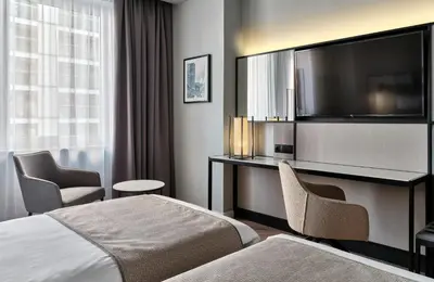 Łóżko lub łóżka w pokoju w obiekcie Leonardo Royal Hotel Warsaw