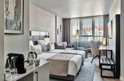Łóżko lub łóżka w pokoju w obiekcie Leonardo Royal Hotel Warsaw