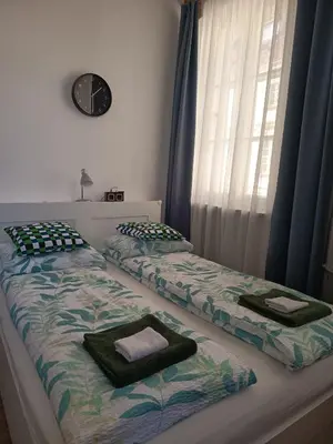 Łóżko lub łóżka w pokoju w obiekcie Przytulny apartament przy Barbakanie