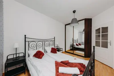 Łóżko lub łóżka w pokoju w obiekcie ShortStayPoland Krochmalna (B39)