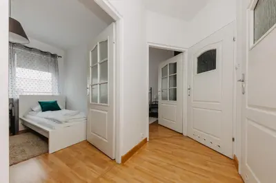 Łóżko lub łóżka w pokoju w obiekcie ShortStayPoland Krochmalna (B39)