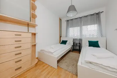 Łóżko lub łóżka w pokoju w obiekcie ShortStayPoland Krochmalna (B39)