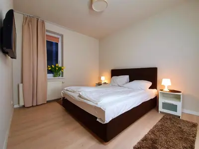 Łóżko lub łóżka w pokoju w obiekcie Chopin Apartments - Eco